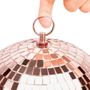 Macro detail of rose gold disco mirror ball with metal hanging hook for party decor