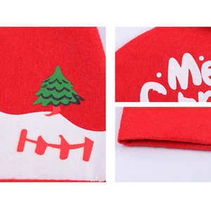 Detail of red felt Christmas car seat cover featuring festive tree and Merry Christmas print