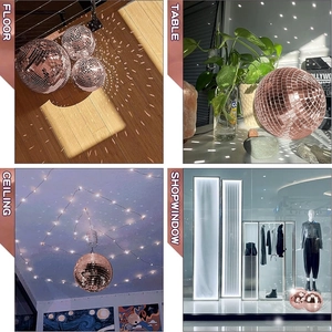Detail view of rose gold mirror disco balls in floor, table, ceiling and window settings