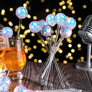Detail of 3cm mirror disco ball stirrers with blue-purple mosaic reflection for cocktails