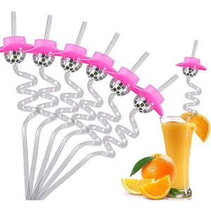 Disco ball straws with pink cowboy hats for party cocktails on white background