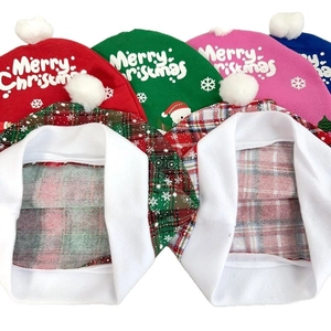 Red, green, and pink knitted Christmas car seat covers with Merry Christmas text