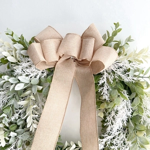 Handmade linen bow wreath with artificial greenery for home wall or door decoration