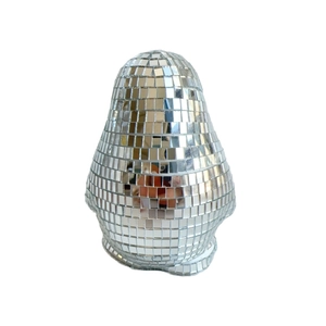 Macro shot of silver mirrored disco ball pear shaped creative home decor sculpture
