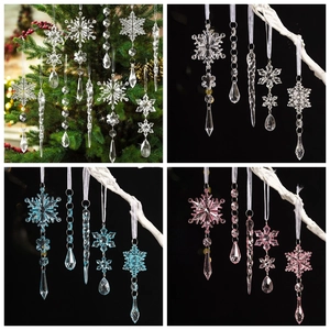 Detail of assorted acrylic snowflake and icicle pendants in transparent, pink and blue