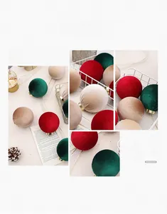 Detailed texture of velvet Christmas balls in red, green and gold with metallic rings