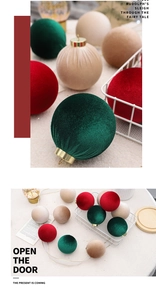 Close-up of velvet Christmas ornaments with golden caps showing high-quality fiber texture
