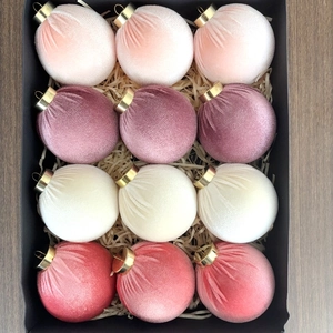 Set of 12 velvet Christmas ornaments in pink shades with gold caps in a gift box