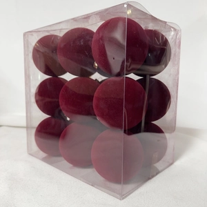 Detailed view of burgundy flocked Christmas ornaments set in a clear display box