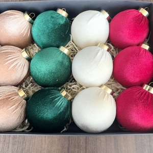 Set of 12 velvet Christmas ball ornaments in festive colors inside a black gift box
