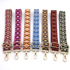 Adjustable wide woven shoulder straps with geometric patterns and gold metal buckles