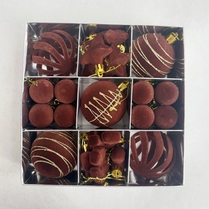 Macro shot of 35-piece deep red flocked Christmas ornaments in a silver gift box