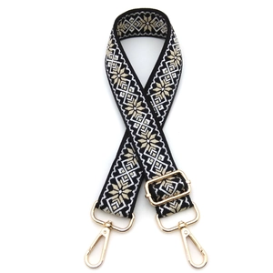 Detail of adjustable ethnic style bag strap with black and white jacquard patterns