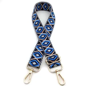 Detail of adjustable geometric diamond weave strap with gold metal lobster clasps