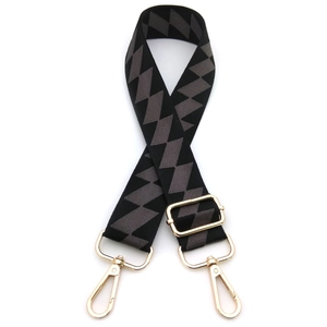 Detail of adjustable wide canvas shoulder strap with black grey geometric diamond pattern
