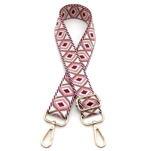 Close-up of adjustable geometric rhombus pattern strap with gold metal lobster clasp