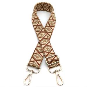 Adjustable jacquard bag strap with geometric diamond pattern and gold-tone metal clips