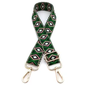 Detail of green pink argyle woven strap with golden metal buckle for crossbody bag
