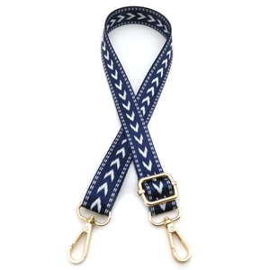 Detail of adjustable geometric arrow strap with polished gold-tone metal lobster clasps