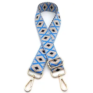 Detailed macro view of geometric diamond pattern weave on adjustable crossbody bag strap