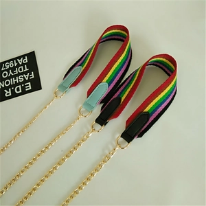 Detail of colorful rainbow striped polyester shoulder straps with gold metal chain links