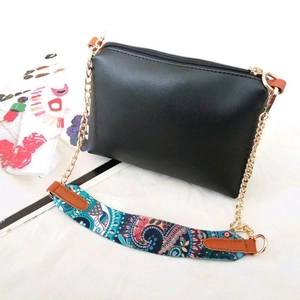 Black PU leather crossbody bag with golden chain and colorful bohemian pattern strap