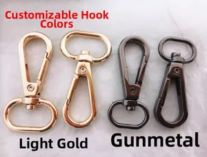Detail of metal swivel snap hooks in light gold and gunmetal for adjustable bag straps
