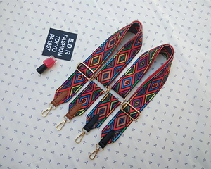 Detail of adjustable woven straps with geometric patterns and golden lobster clasps
