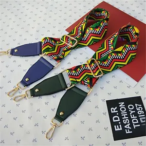 Close-up of adjustable woven bag strap with colorful bohemian geometric patterns