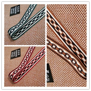 Close-up of three colorful chain pattern jacquard woven bag straps with metal clasps