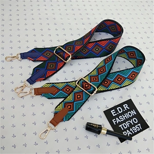 Adjustable geometric ethnic style bag strap with gold metal hooks and woven texture