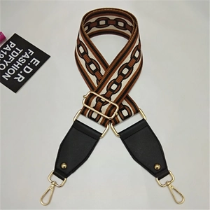 Detail of adjustable woven wide shoulder strap with chain pattern and gold hardware hooks