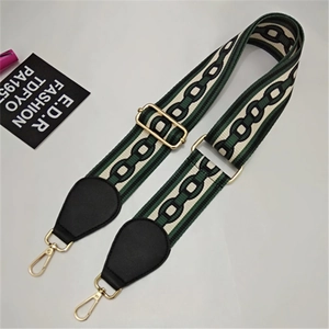 Detail showing adjustable green and white striped bag strap with gold metal hooks