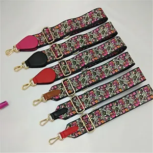 Close-up of adjustable colorful ethnic pattern shoulder straps with gold metal hardware