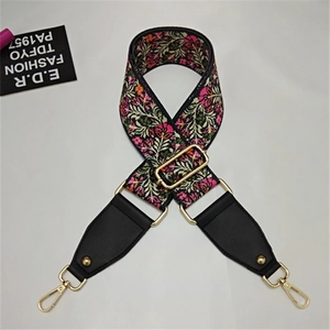 Close-up of bohemian jacquard strap with floral patterns and gold metal hardware