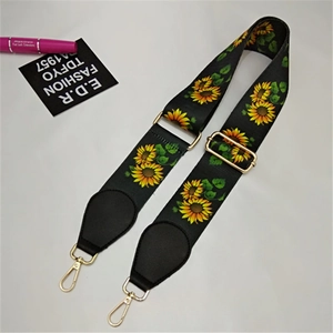 Verstellbarer schwarzer Taschenriemen mit gelber Sonnenblumen-Stickerei und Goldbeschlägen