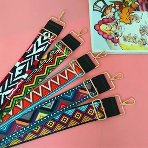 Detailed flat lay of ethnic geometric replacement straps with gold lobster clasps