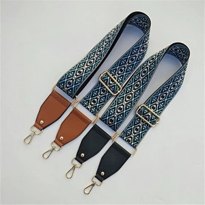 Detail of adjustable ethnic style embroidered wide straps with gold metal clasps