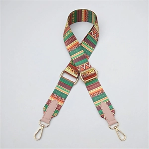 Bohemian geometric woven bag strap with pink leather ends and gold metal buckles