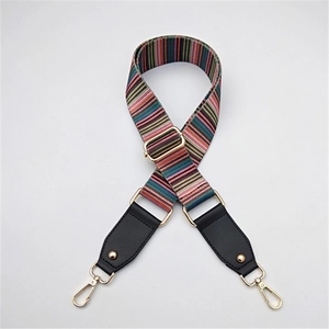 Adjustable woven canvas shoulder strap with colorful stripes and gold metal hardware