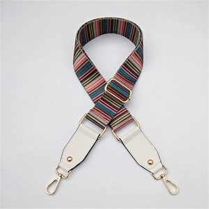 Adjustable rainbow striped bag strap with white leather ends and gold metal hardware