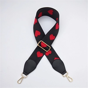 Adjustable wide black crossbody strap with red heart embroidery and gold hardware