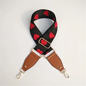 Adjustable wide replacement bag strap with red heart embroidery and gold hardware