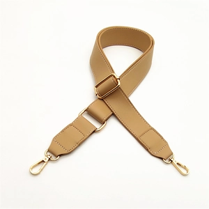 Detail of adjustable camel PU leather shoulder strap with gold metal lobster clasps