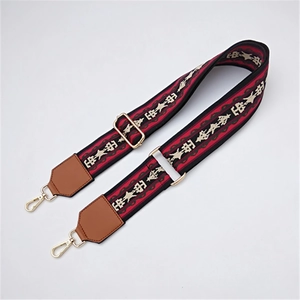 Adjustable bohemian style wide woven shoulder strap with geometric star patterns and gold hooks