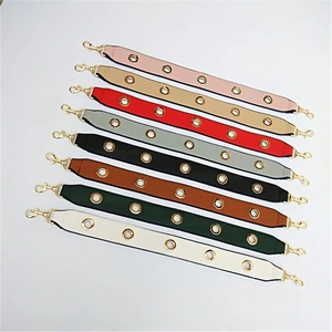 Detail of adjustable PU leather bag straps in various colors with golden metal eyelets