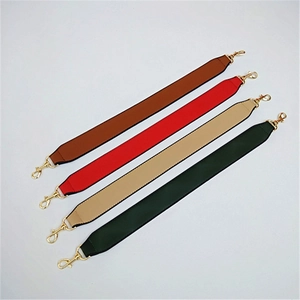 Detail view of colorful wide PU leather bag straps with premium gold lobster clasps