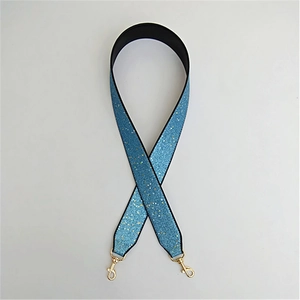 Detail of light blue glitter wide replacement shoulder strap with gold lobster clasps