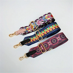 Detail of adjustable woven replacement bag straps with ethnic patterns and metal hooks