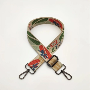 Adjustable woven floral bag strap with colorful embroidery and metal swivel hooks